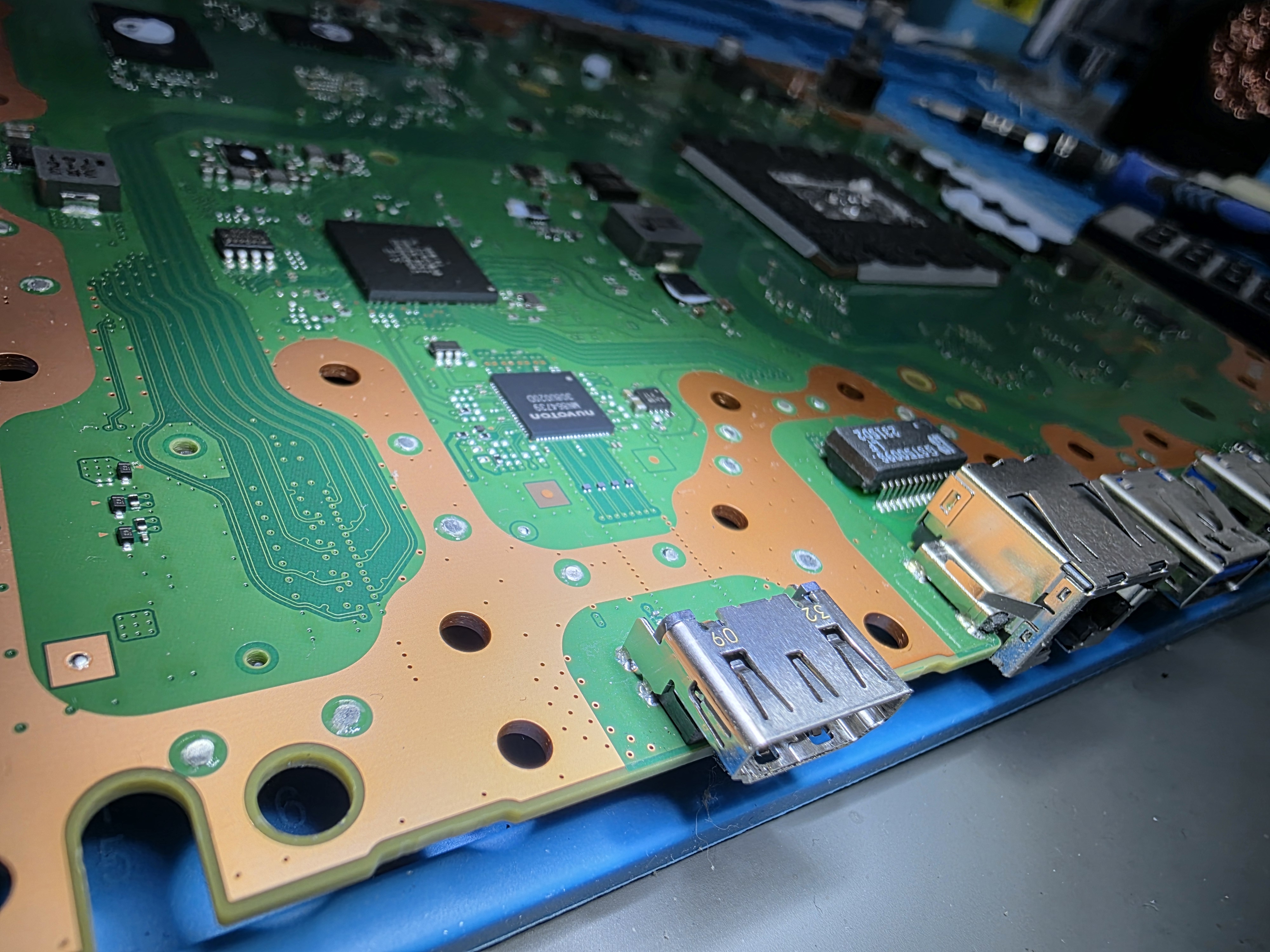 PS5 motherboard HDMI port area during repair
